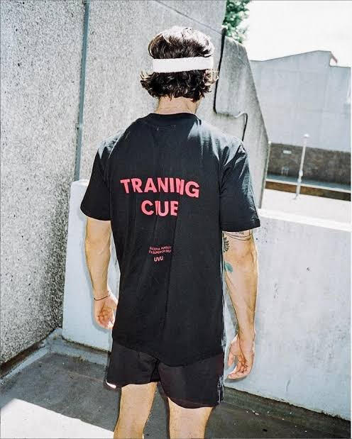 an image of a model wearing a uvu training club tshirt